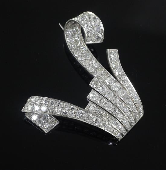 A platinum and diamond encrusted clip brooch, 39mm.